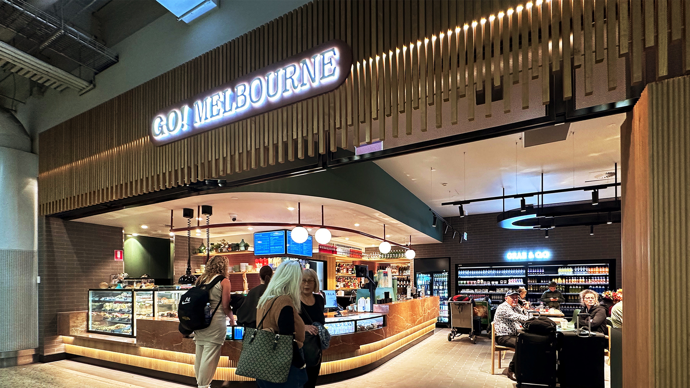 Modern store front with 'GO! MELBOURNE' sign in a shopping mall.